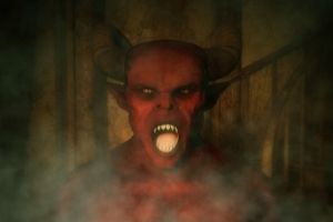 scary red face of a demon with horns