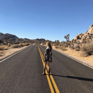 Best Things About 2018. Bryn Donovan, wearing cowboy boots, in Joshua Tree National Park