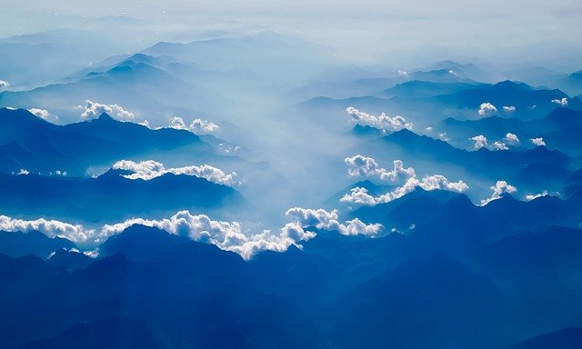 Clouds and view of mountains from above.