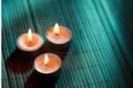 3 votive candles on a grass mat: POSITIVE AFFIRMATIONS FOR ANXIETY MANAGEMENT by Bryn Donovan, with positive affirmations for wealth, health, and more