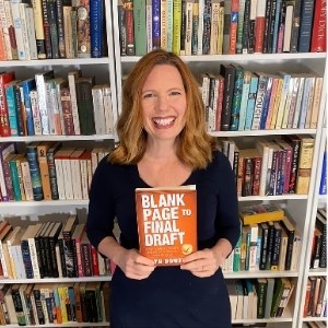 Bryn Donovan standing in front of bookshelves holding the paperback BLANK PAGE TO FINAL DRAFT