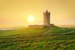 MEDIEVAL LAST NAMES from England | image of castle from the Middle Ages, in a field in the sunshine in England