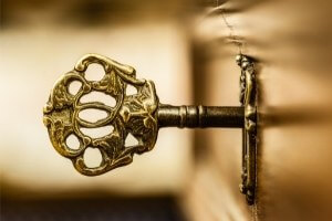 key in lock representing a mystery clue
