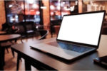 laptop on table in a peaceful cafe