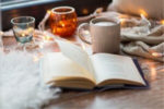 self-care book with cozy candles and coffee