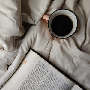 dictionary, coffee, on bed
