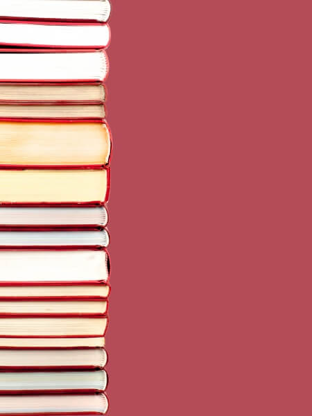 a stack of books with red covers