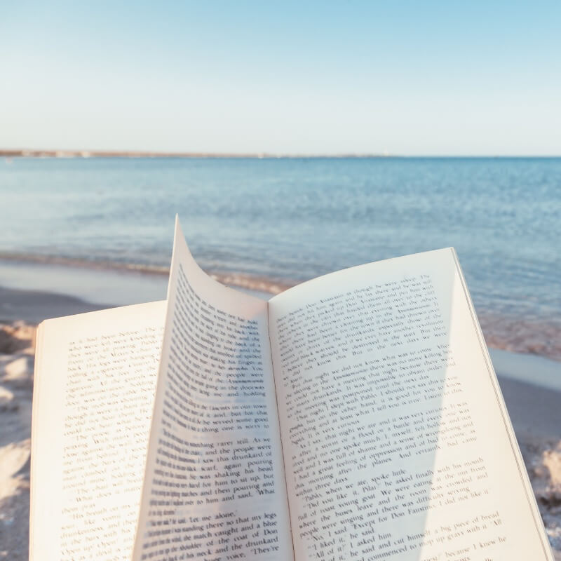 How to Describe a Beach - open book and beach background