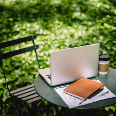 outdoor table and chair, laptop, notebook, coffee