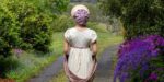 Regency era lady talking a walk in the pretty countryside