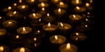 many lit votive candles in the dark - 50 ways to fight fascism for dystopian writers