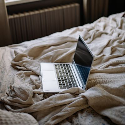 laptop on bed