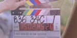 closeup of director clapboard with the tile Her Knight at the Museum