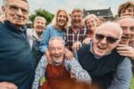 a friend group of older adults having fun and posing for camera - advice for writing old people characters