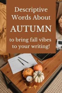 text reads: Descriptive Words about Autumn to bring fall vibes to your writing! image of pumpkins, notebook, laptop, story in progress