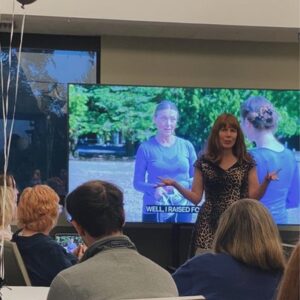 author Bryn Donovan explaining something about a movie to partygoers