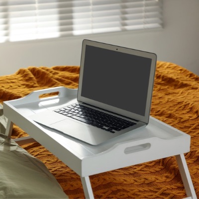 laptop computer on bed - do song titles go in quotes